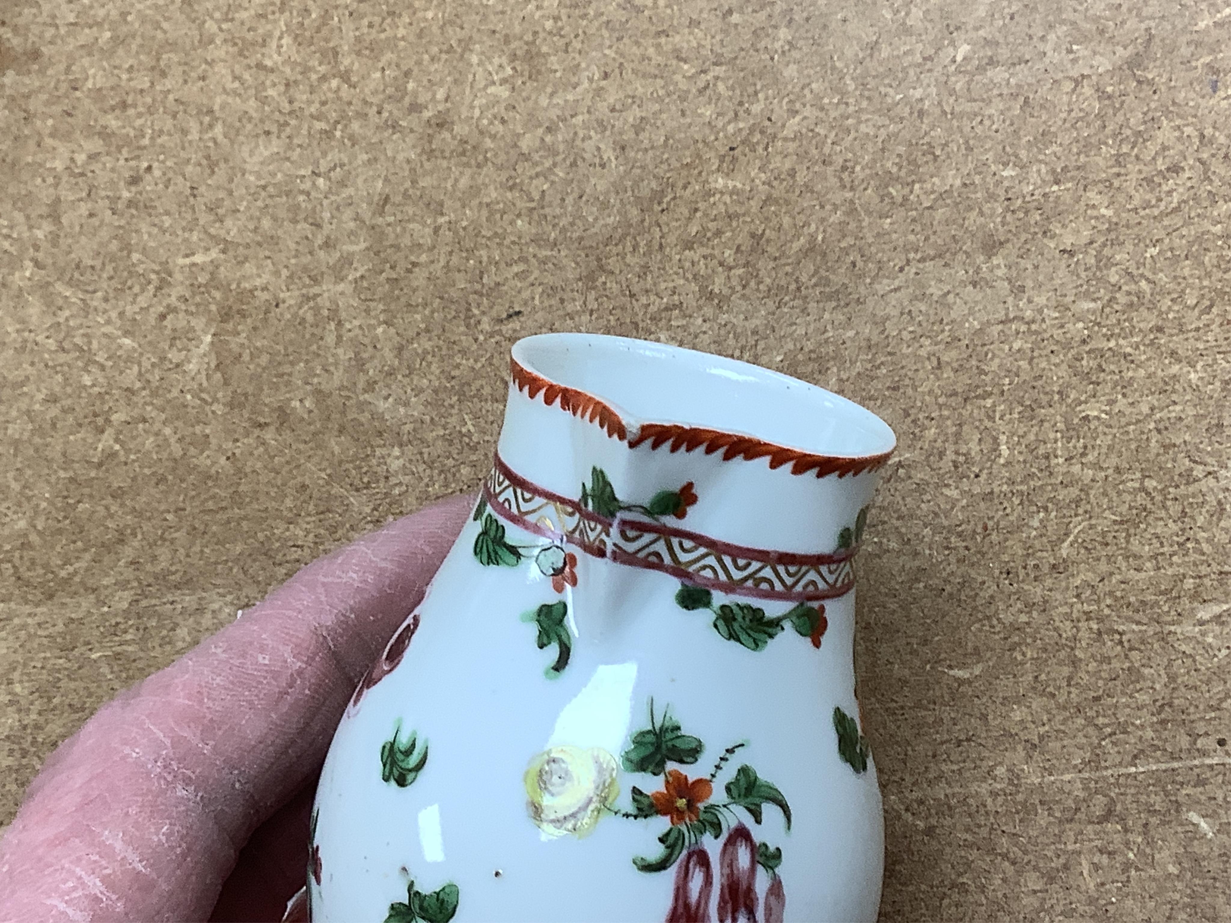 Worcester polychrome tea and coffee wares, c.1760-1780, comprising a tea caddy, a cream jug, five coffee cups and a fluted bowl, the latter with red anchor mark (8), largest tea caddy 14cm high.